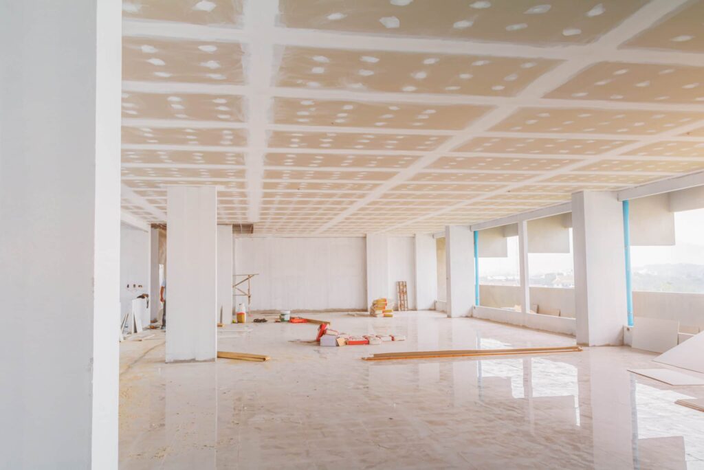 a commercial room with white walls and white pillars
