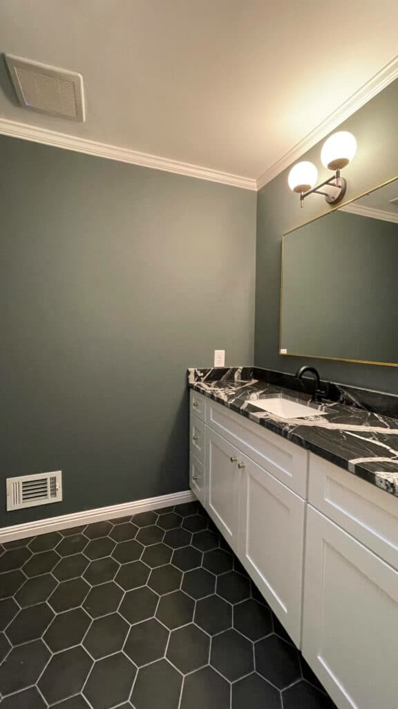 bathroom with dark green paint