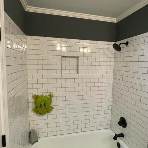 modern subway tile bathroom with wall painted Homburg Gray SW 7622