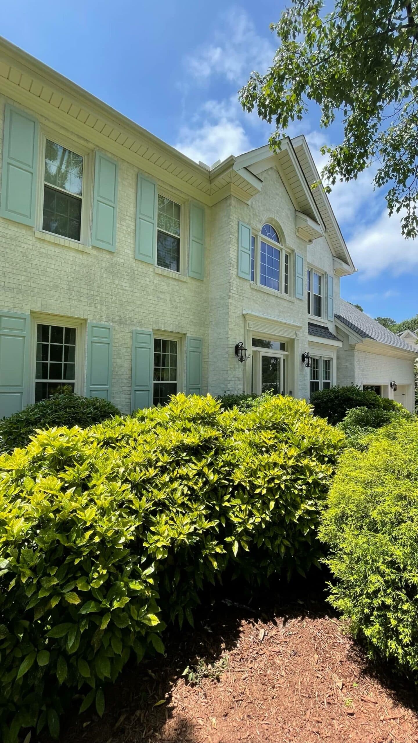 White-and-blue-shutter-painted-brick-cary-nc