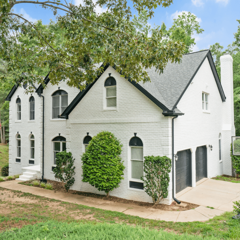 painted brick home with romabio brick paint by Oak City Coatings, a raleigh exterior paint company