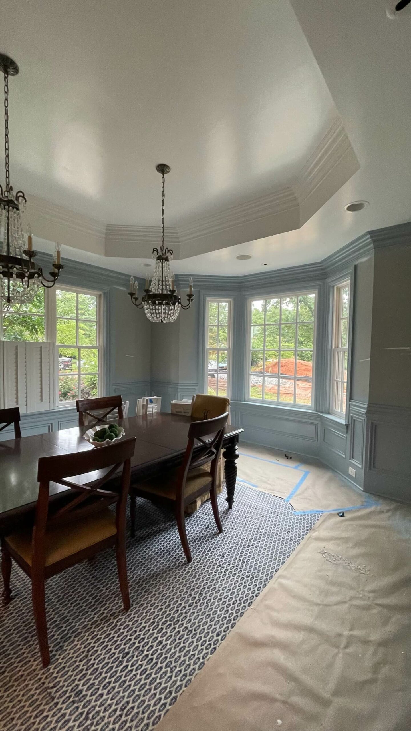 Dining room prepped for painting by Oak City Coatings