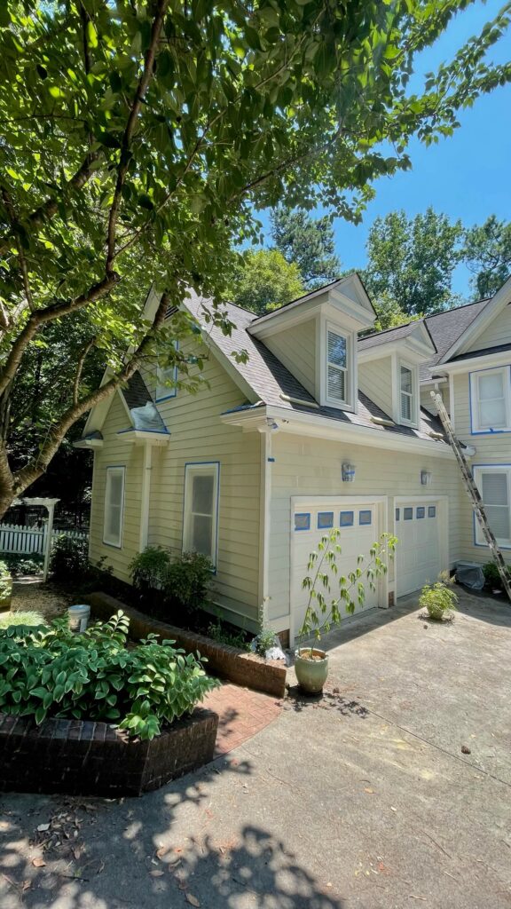 home in raleigh, nc getting an exterior paint job by Oak City Coatings, exterior paint company.