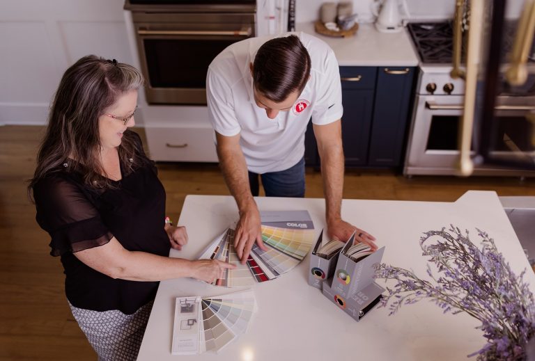 Oak City Coatings Color Specialist and Owner, Nick O'Keefe looking at paint colors in Raleigh Kitchen.