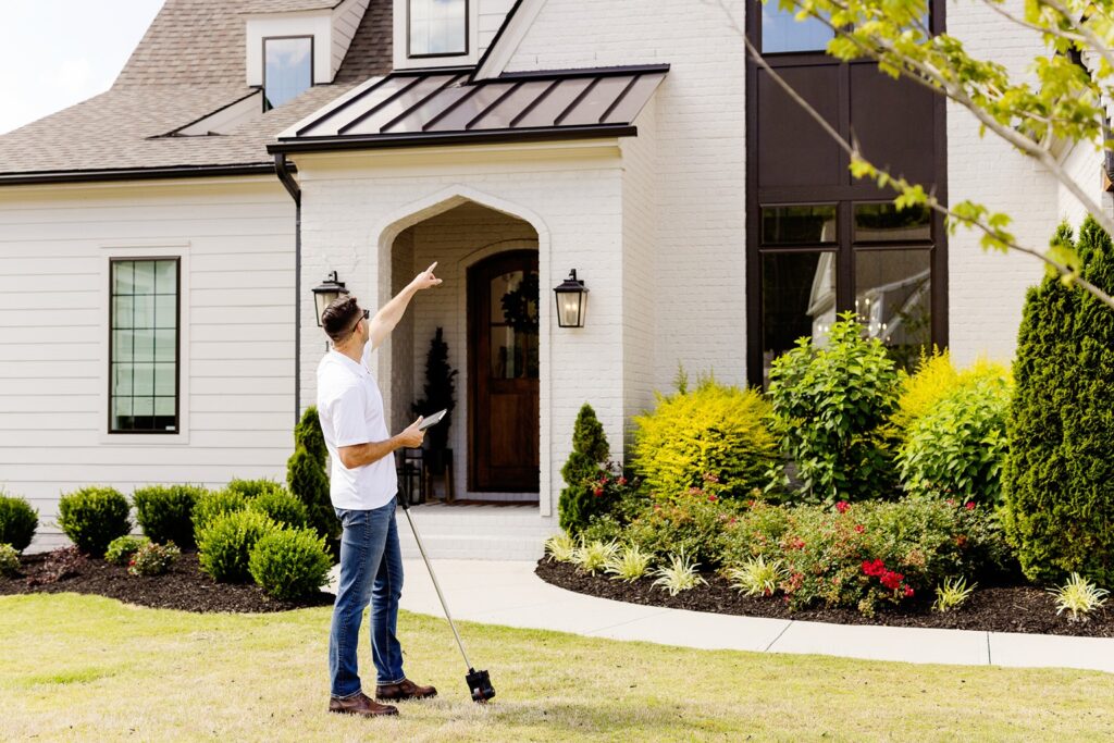 Nick O'Keefe, owner of Oak City Coatings reviewing exterior paint warranty in Raleigh house.