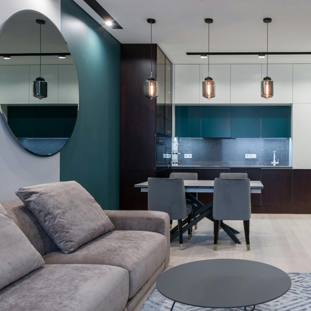 teal painted accent wall in modern studio living room
