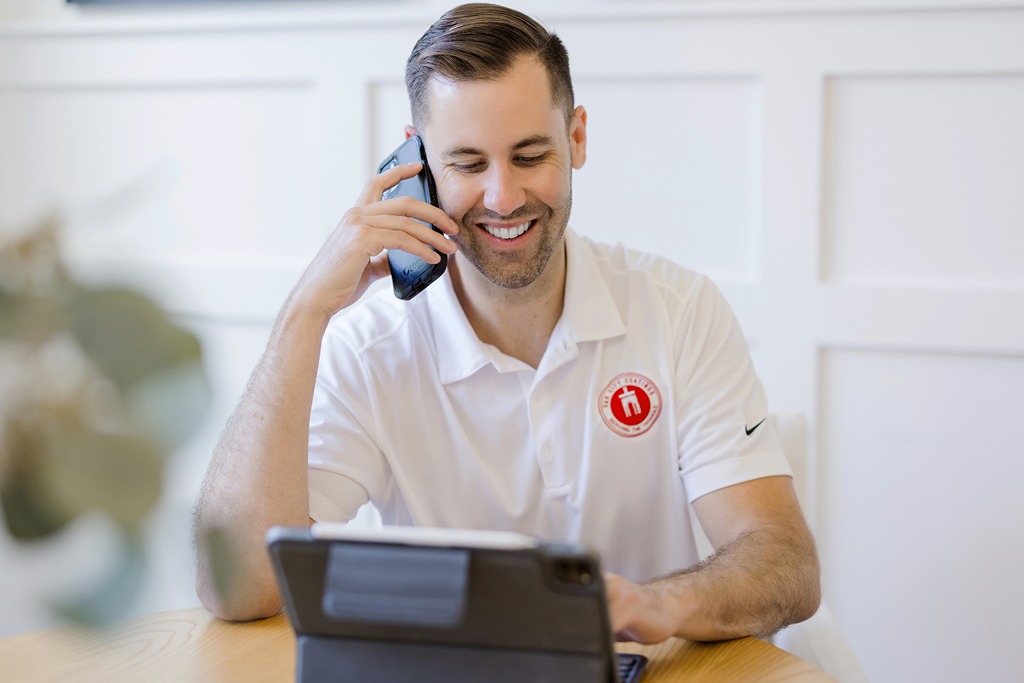 Nick Okeefe on phone answering questions about Oak City Coatings