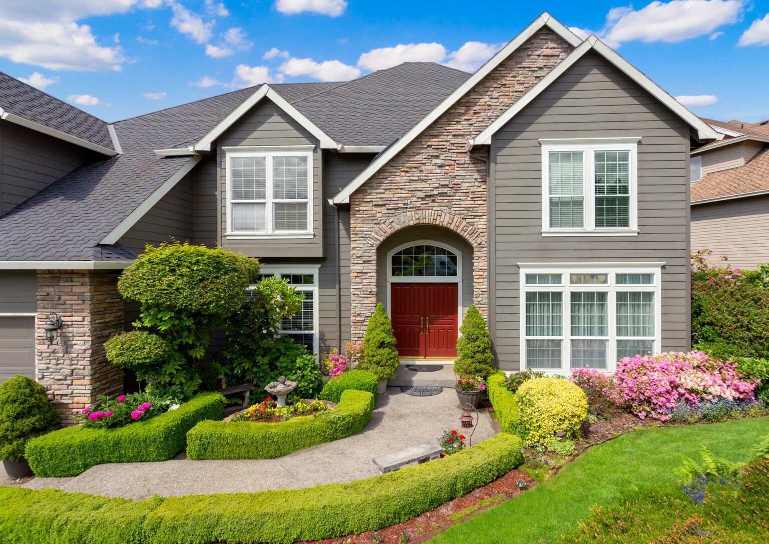 gray and stone house after exterior painting in raleigh nc