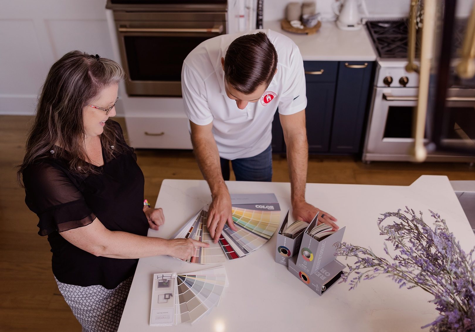 Oak City Coatings Color Specialist and Owner, Nick O'Keefe looking at paint colors in Raleigh Kitchen.