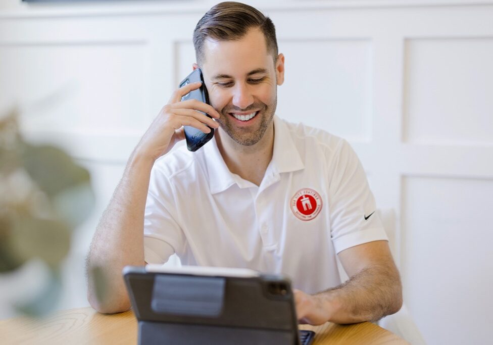 Nick Okeefe on phone answering questions about Oak City Coatings