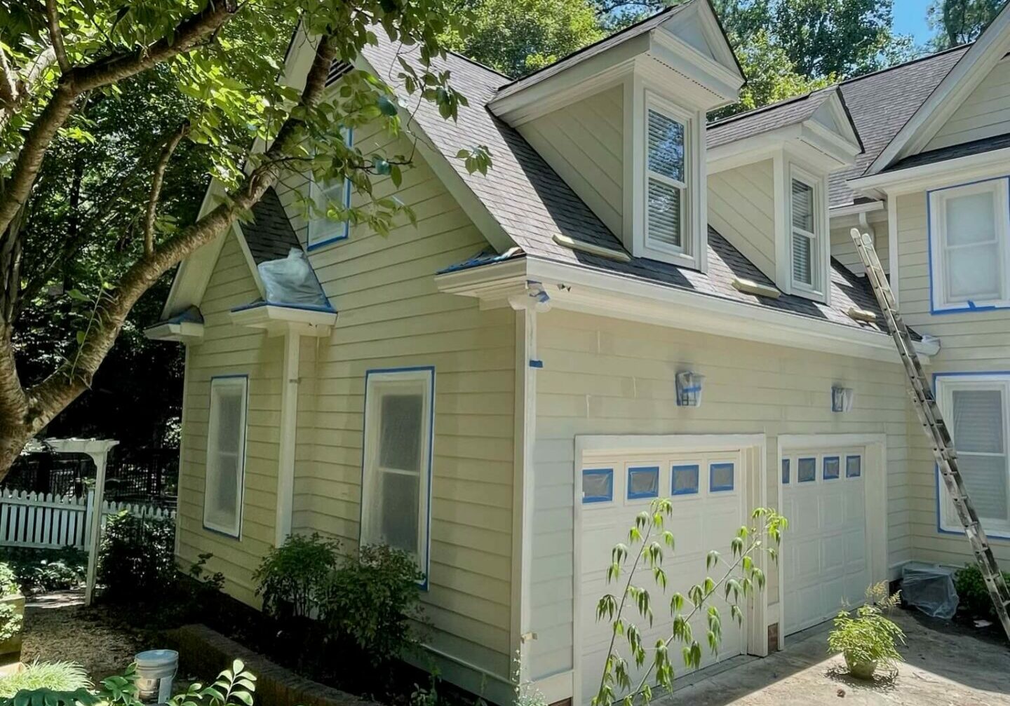 home in raleigh, nc getting an exterior paint job by Oak City Coatings, exterior paint company.