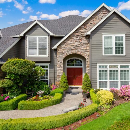 gray and stone house after exterior painting in raleigh nc