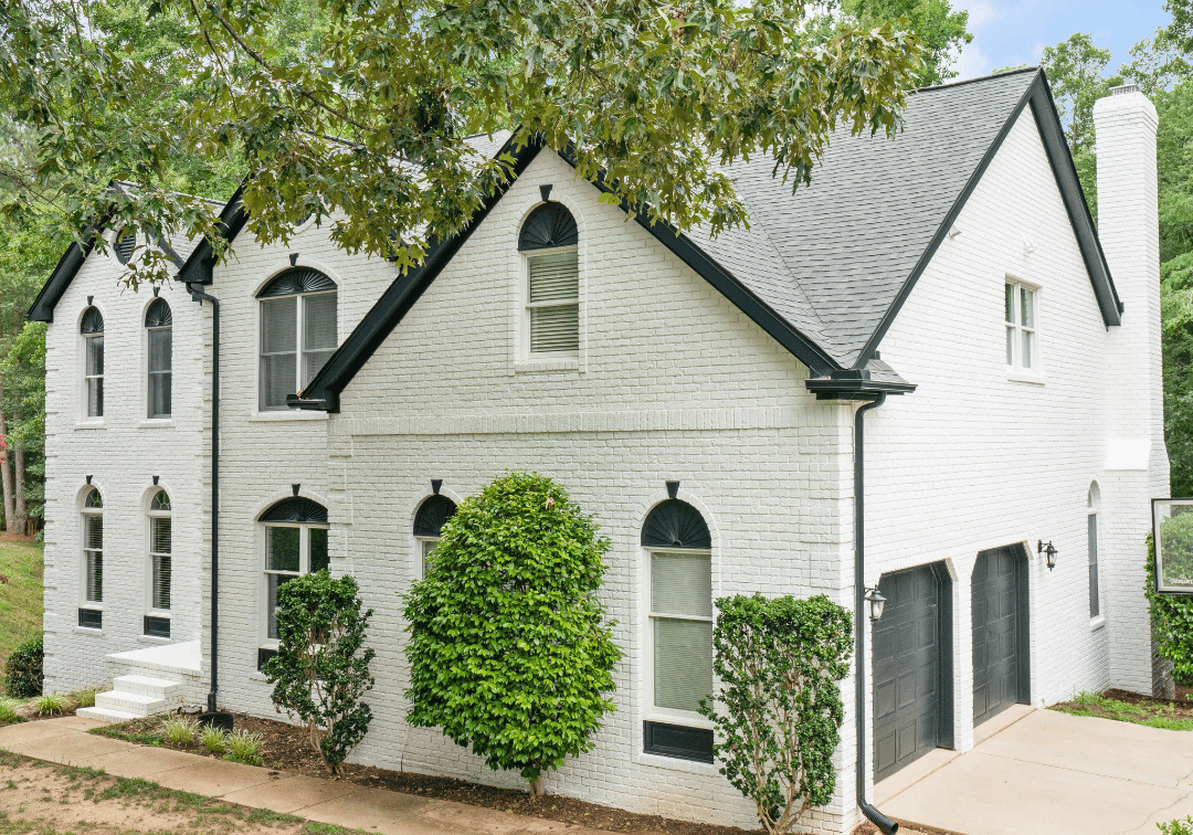 painted brick home with romabio brick paint by Oak City Coatings, a raleigh exterior paint company